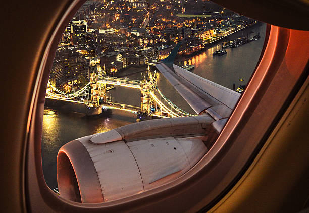 A traveler holding a UK Visa approval document with the London skyline in the background