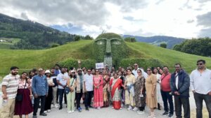 A happy travel group posing together during their Europe trip with iconic European architecture in the background.